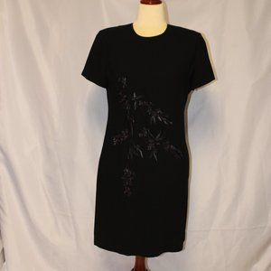 Embrace Elegance in this Stunning Black Dress with Exquisite Flower Appliqué!